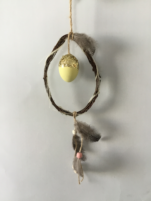 Twig hanger with egg and feather
