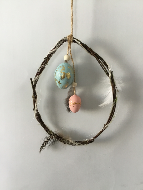 Twig hanger with egg and feather