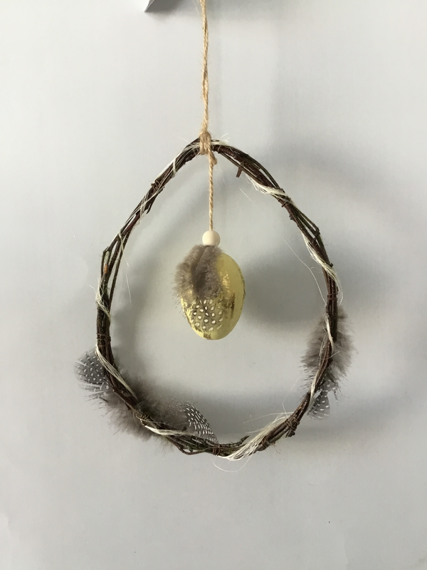 Twig hanger with egg and feather