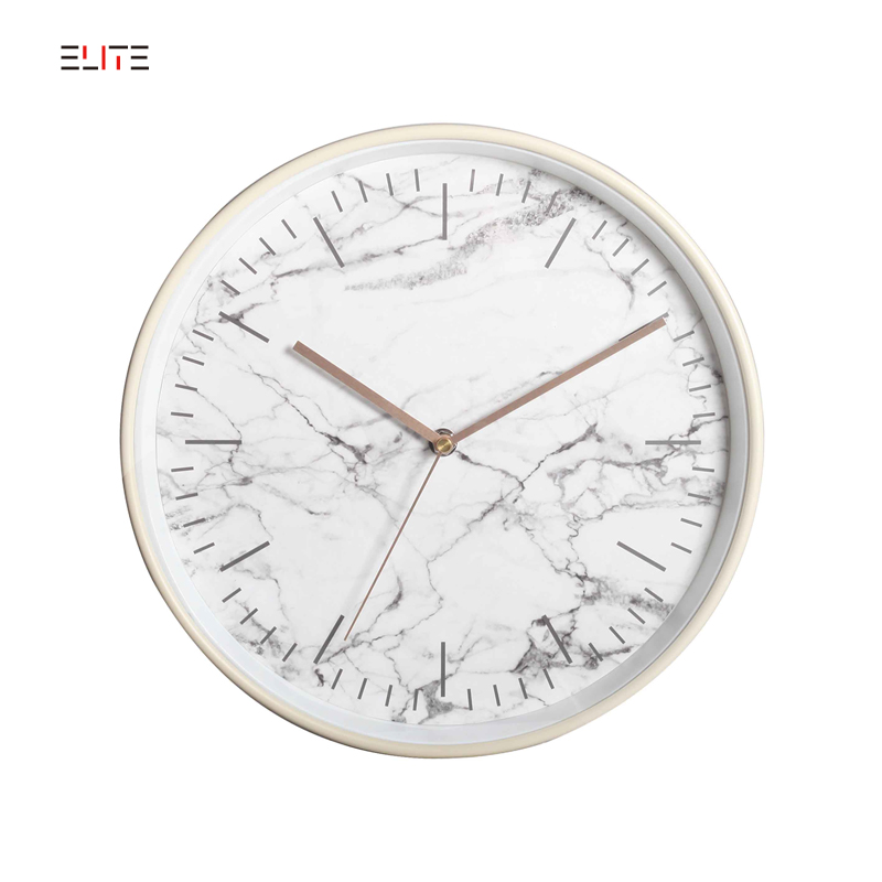 Metal wall clock with face in marble pattern