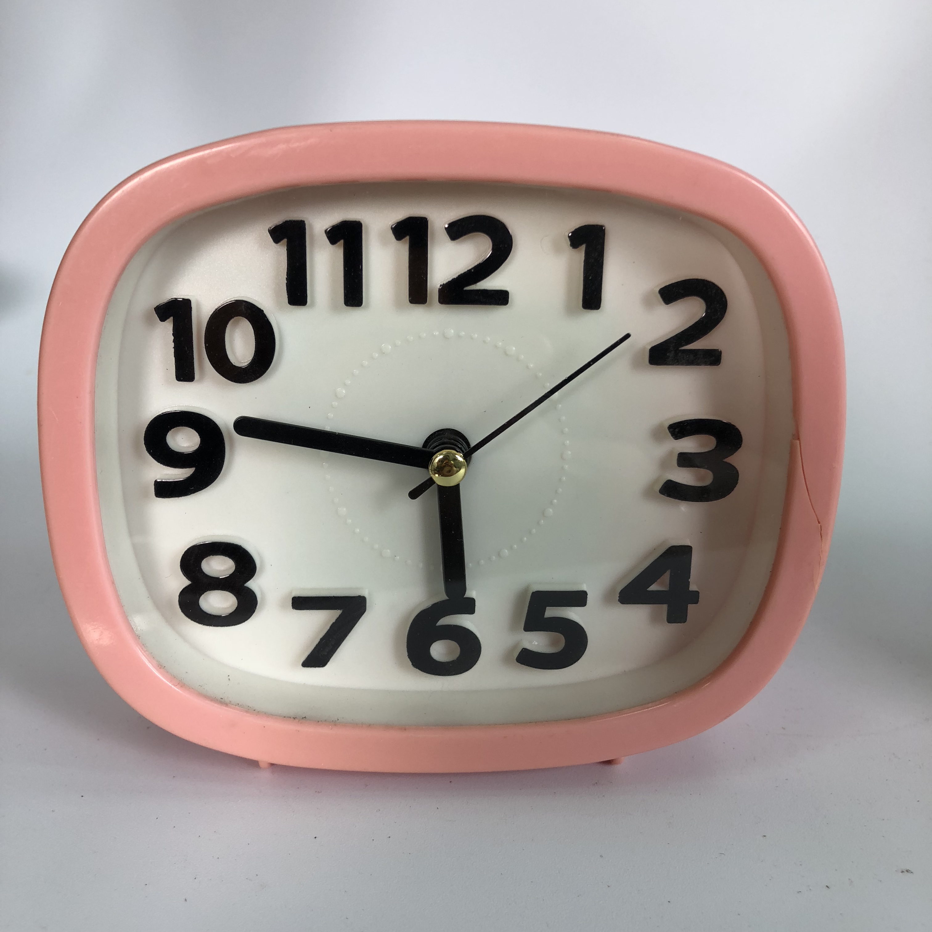 Plastic square alarm clock with raised numbers