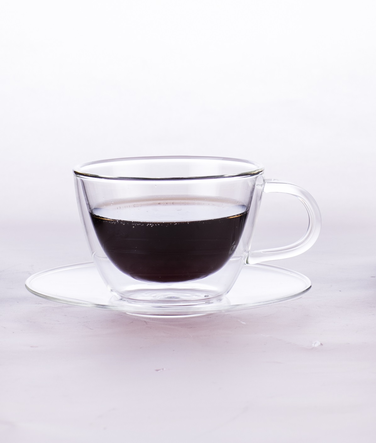 Double wall glass coffee cup with saucer