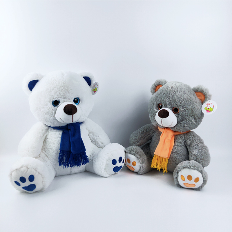 Plush sitting bear with scarf