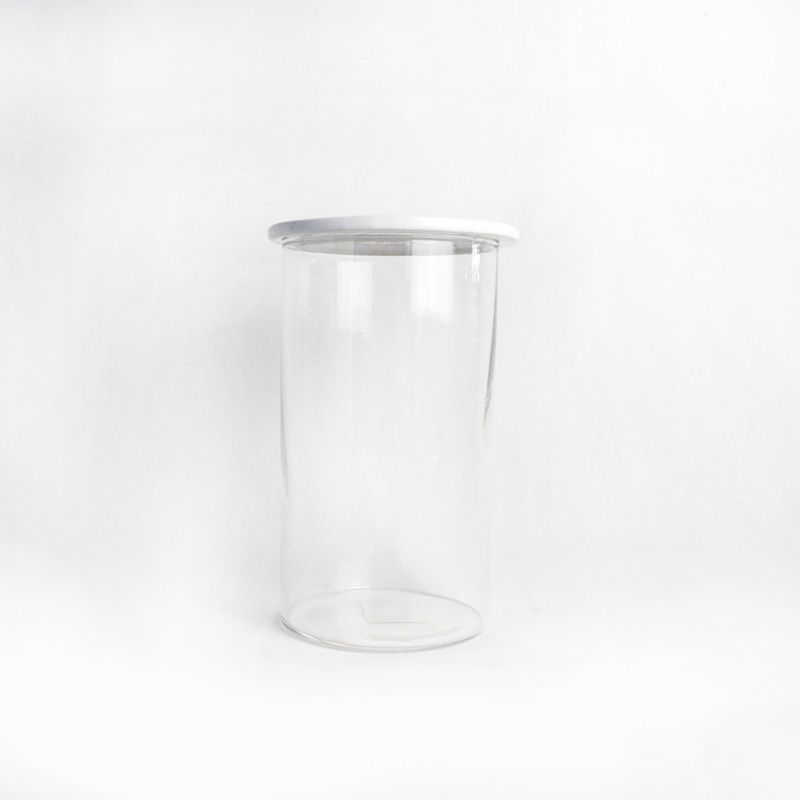 Transparent glass vase with ceramic lip