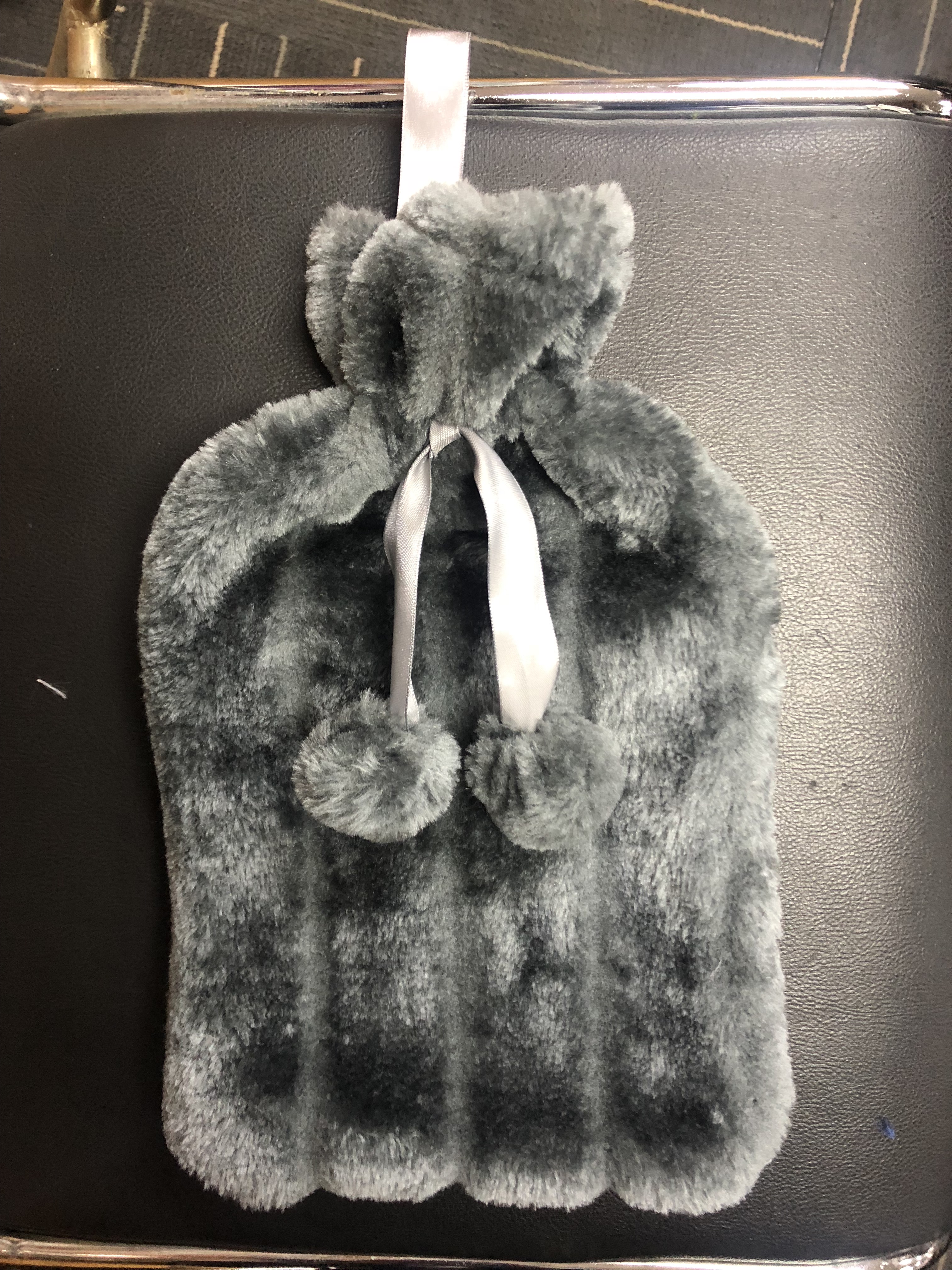 Rubber hot water bottle with plush cover