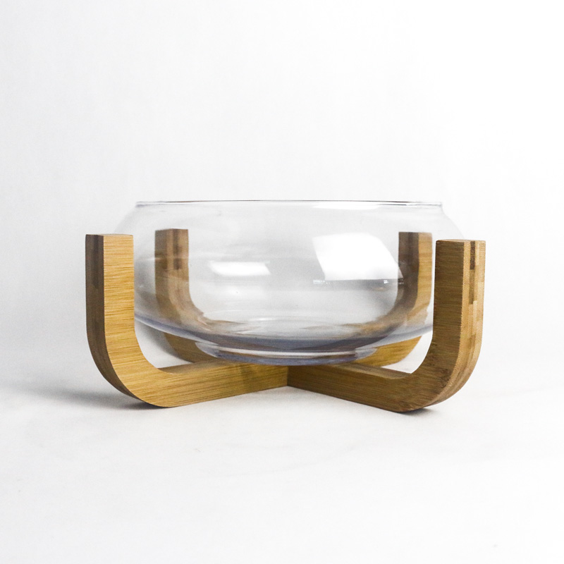 glass fish bowl wi th wooden base