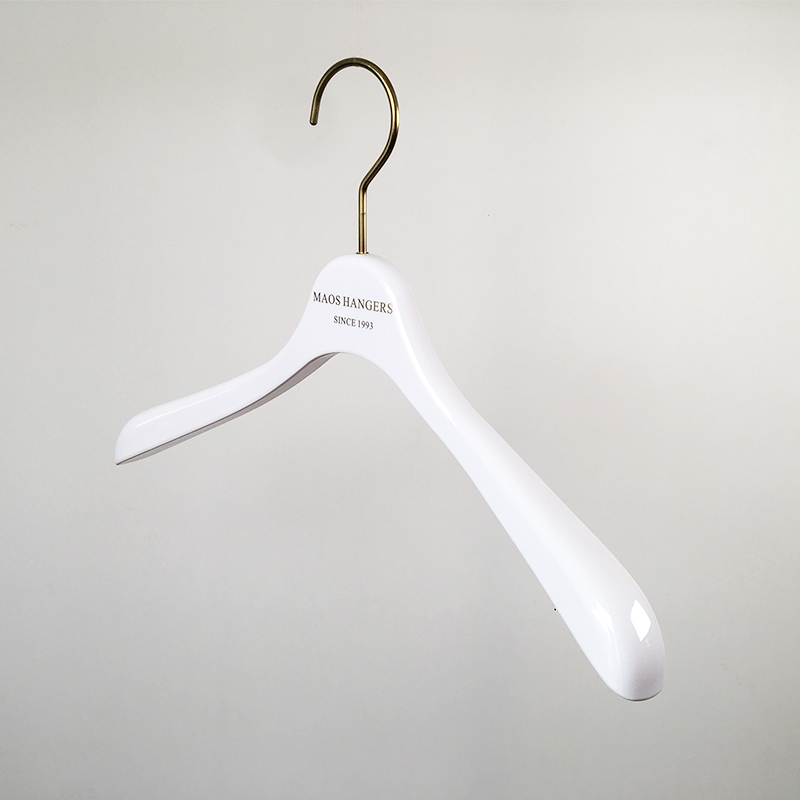 Hollow plastic top hanger with wide shoulders