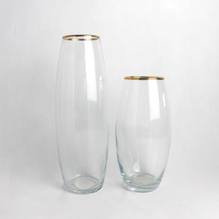 tall transparent glass vase with golden open