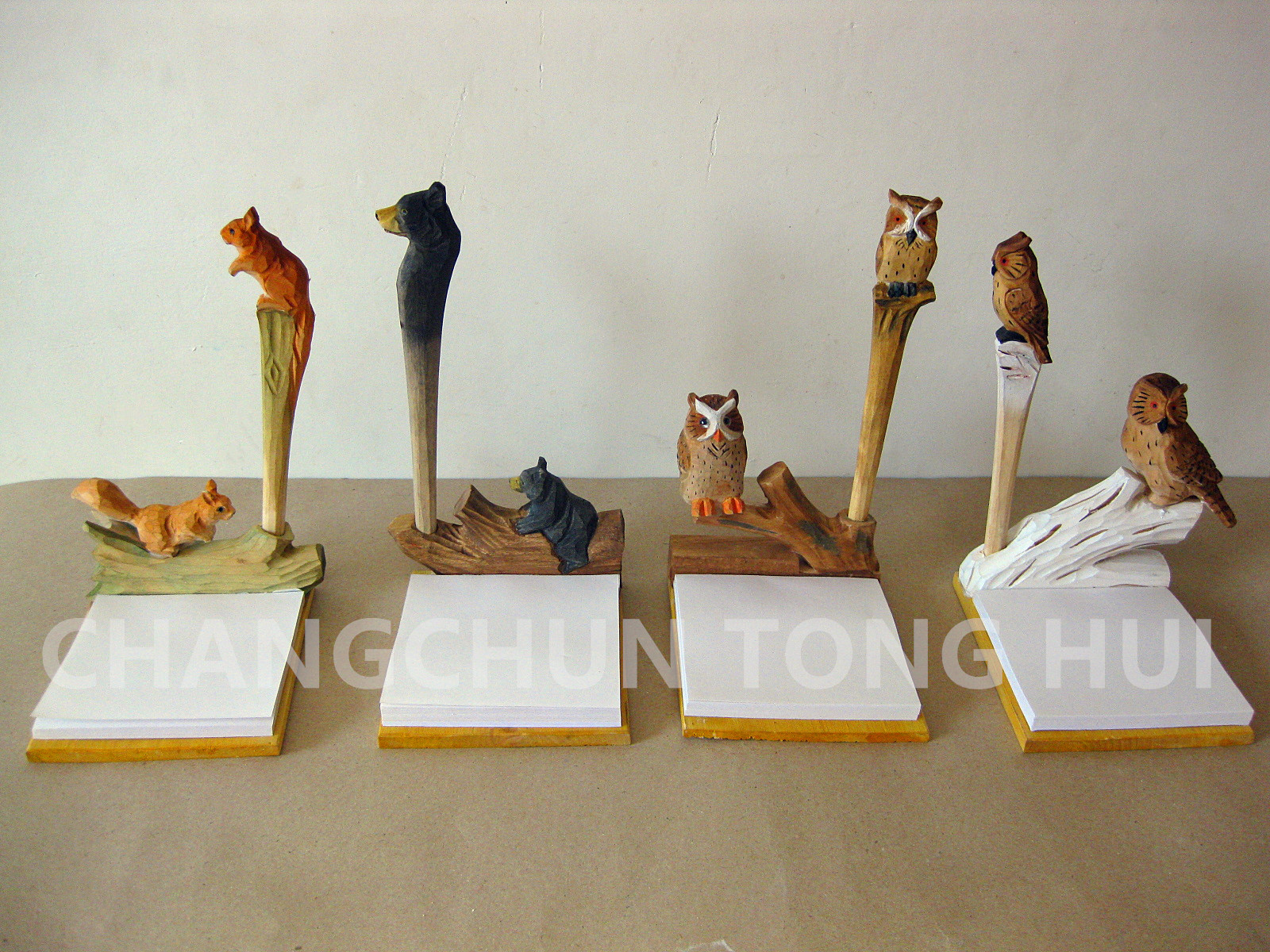 wood carved note pad with animal design