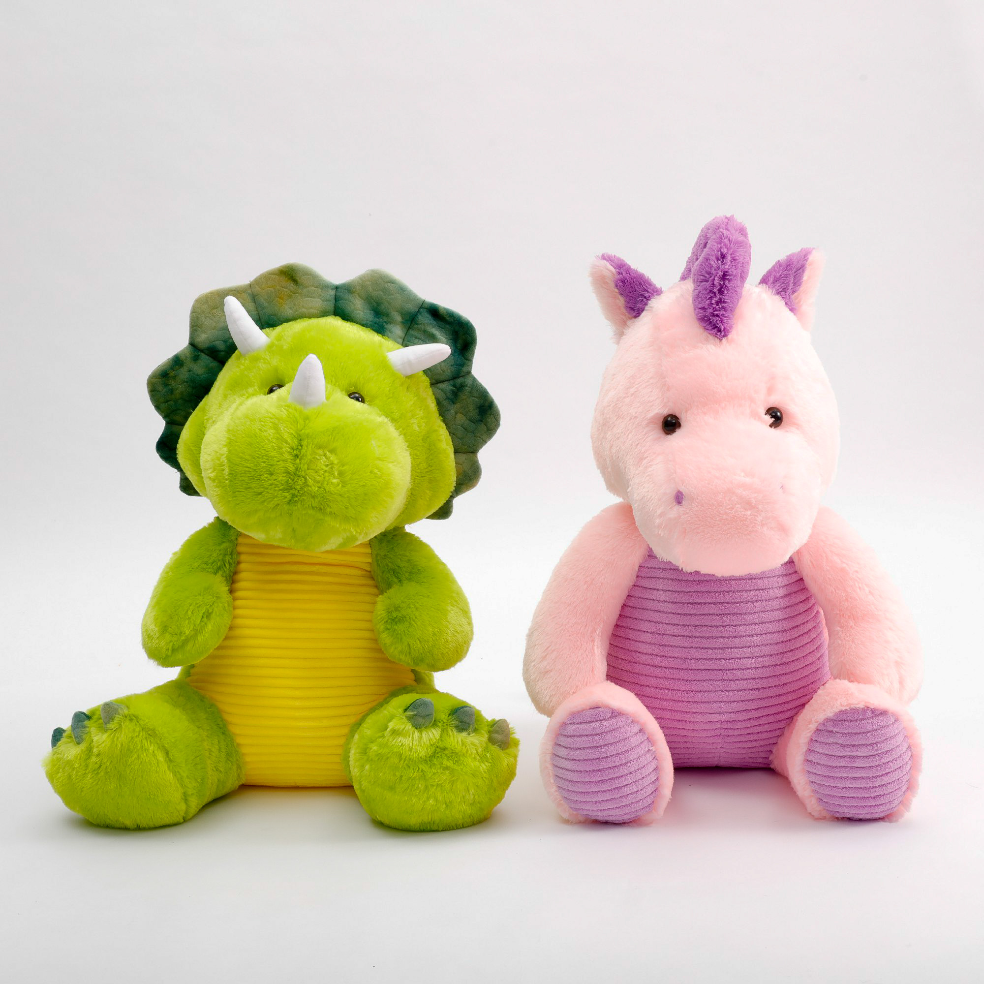 Large plush dinosaur and unicorn