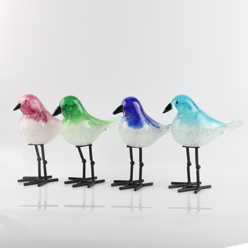 glass bird with foot