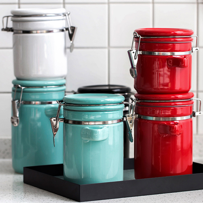 4 piece ceramic canister set with wooden spoons
