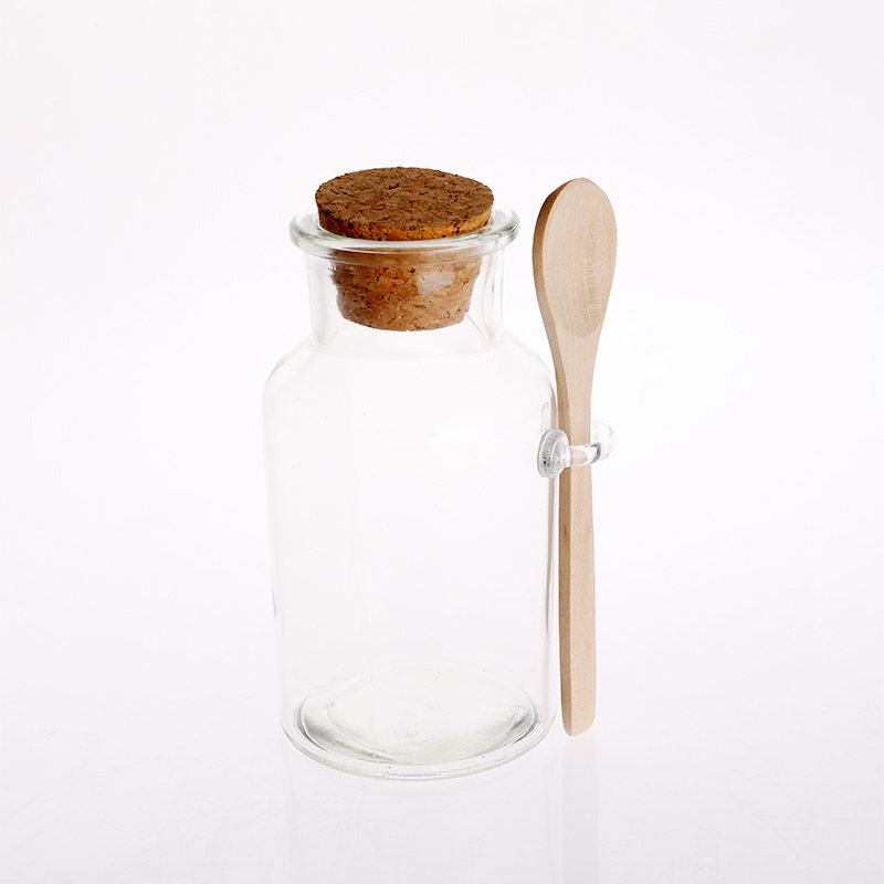 glass canister with cork lid and bamboo spoon