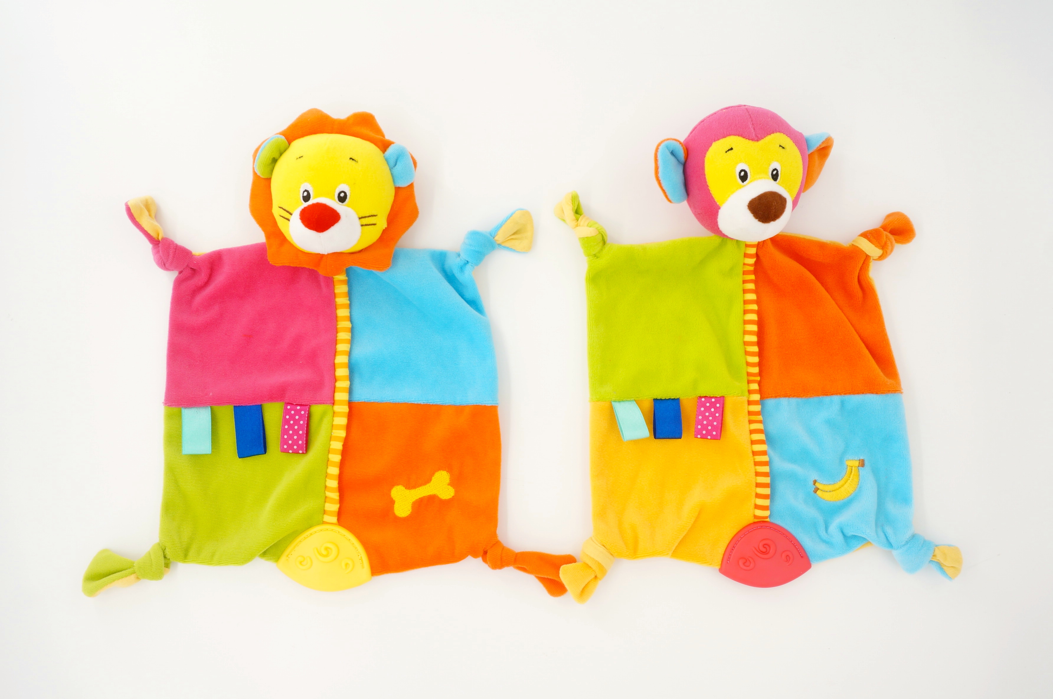 Baby blanket with teether, rattle and crinkle paper