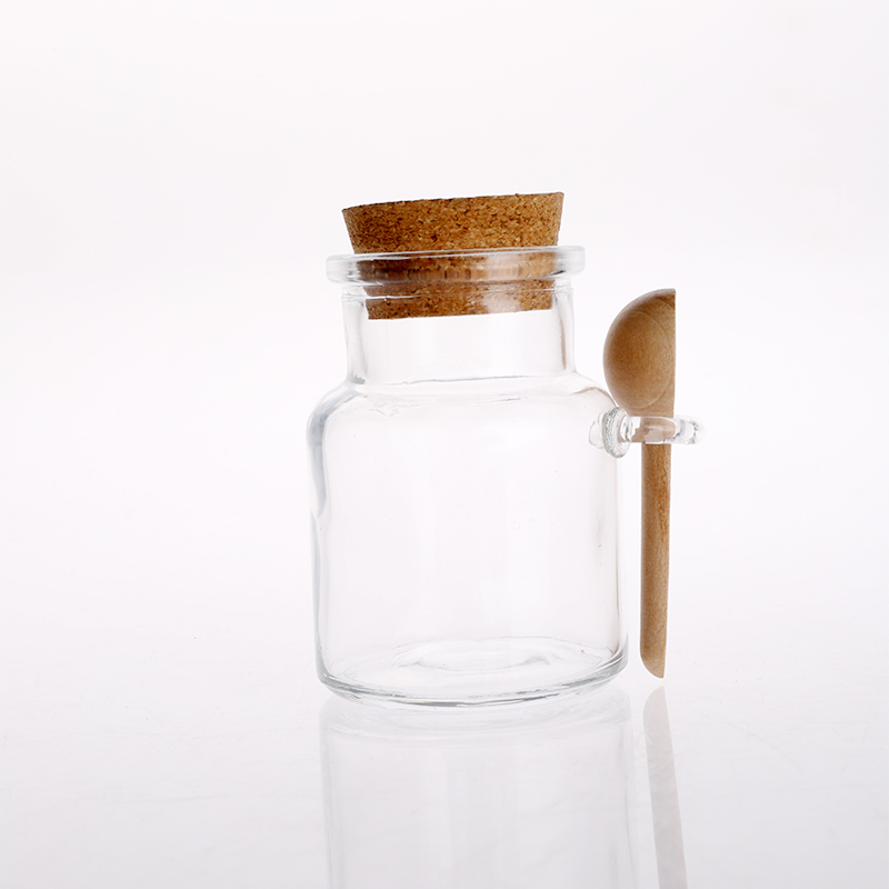 Glass canister with cork lid and bamboo spoon
