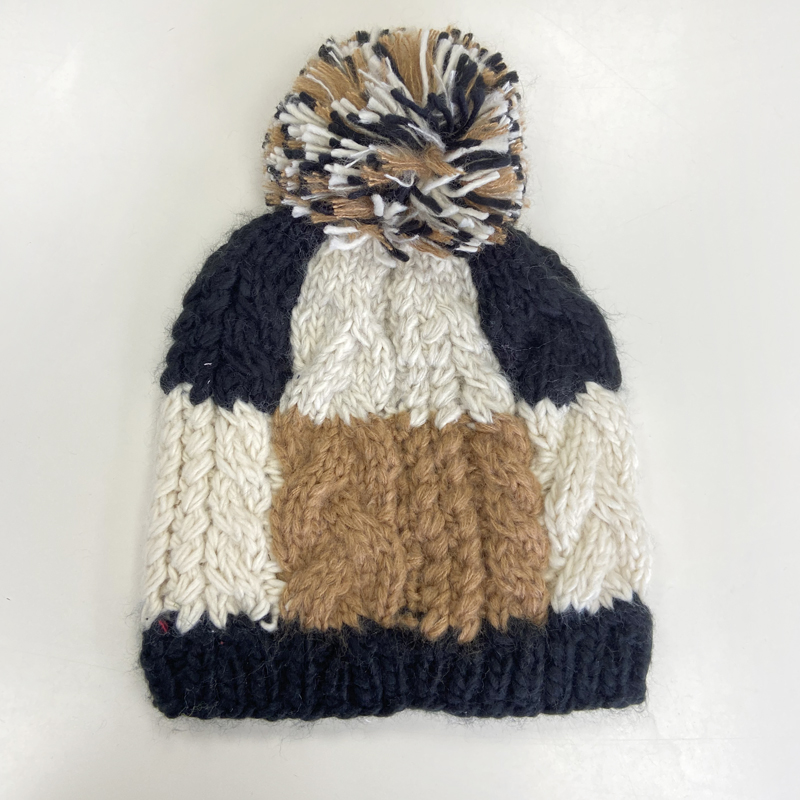 patchwork knitted hat with pompom