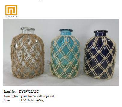 glass bottle with color with rope net