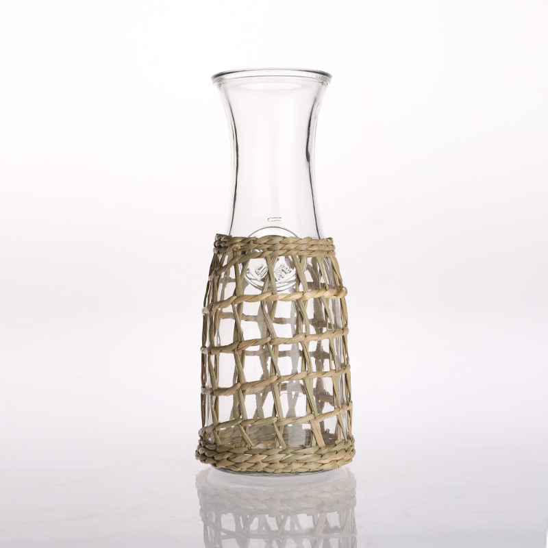 Straw plaiting glass jug