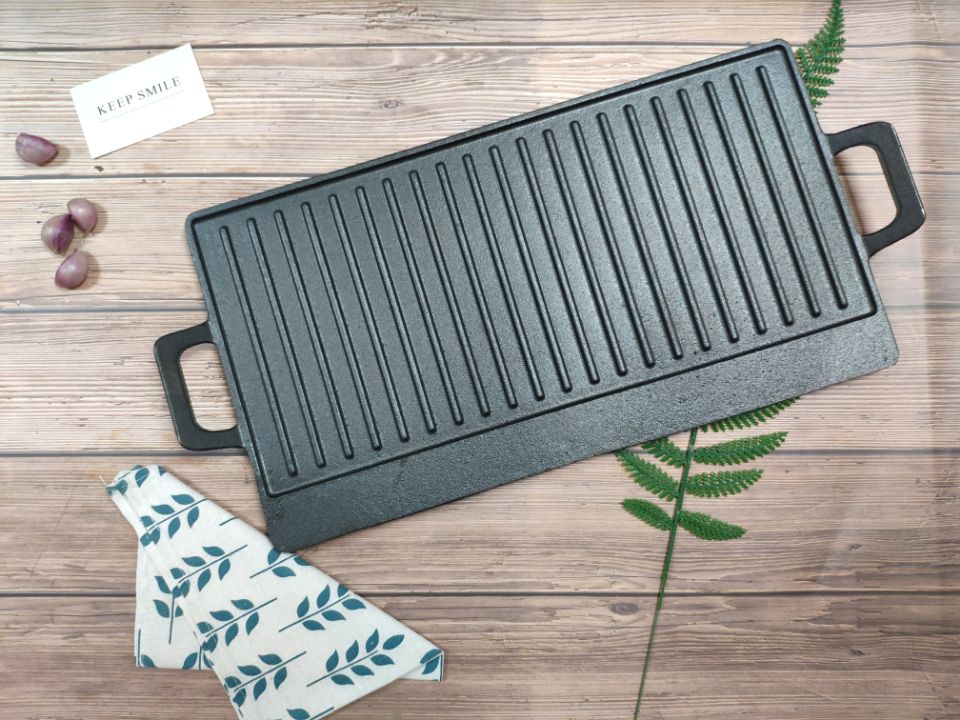 Cast iron reversible griddle.