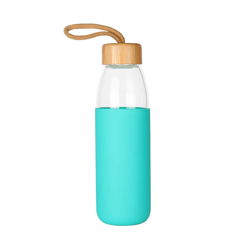 Glass water bottle with bamboo lid and silicone sleeve