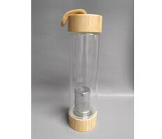Glass water bottle with stainless steel filter and bamboo lid