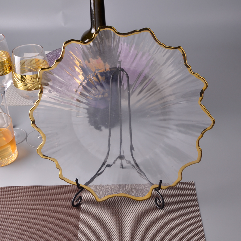 Glass charger plate in the shape of a flower with a gold rim