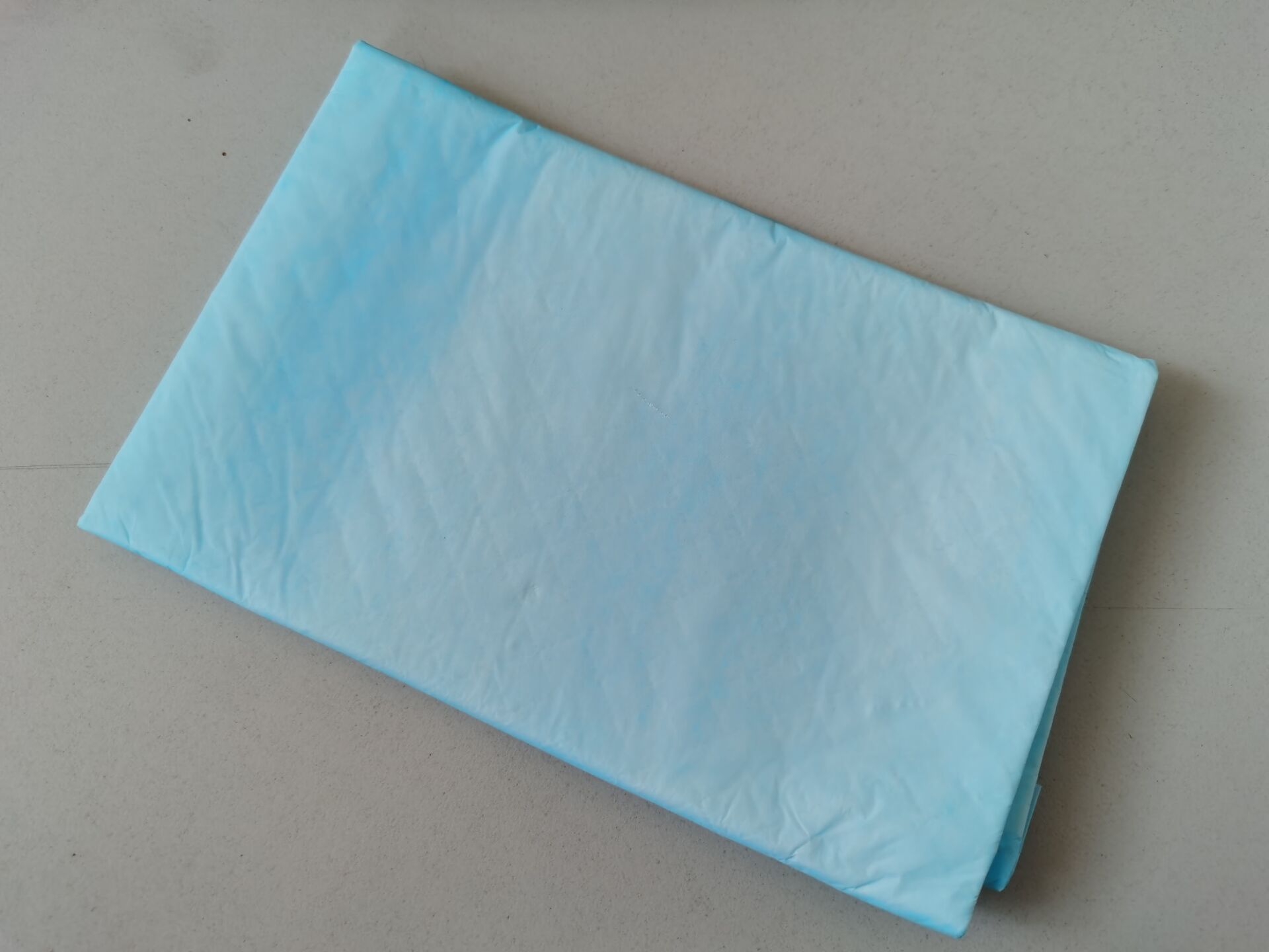 Pet pad with blue PE film