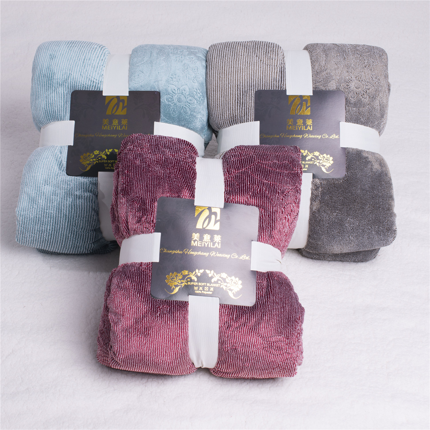 Two layer cation embossed blankte with sherpa