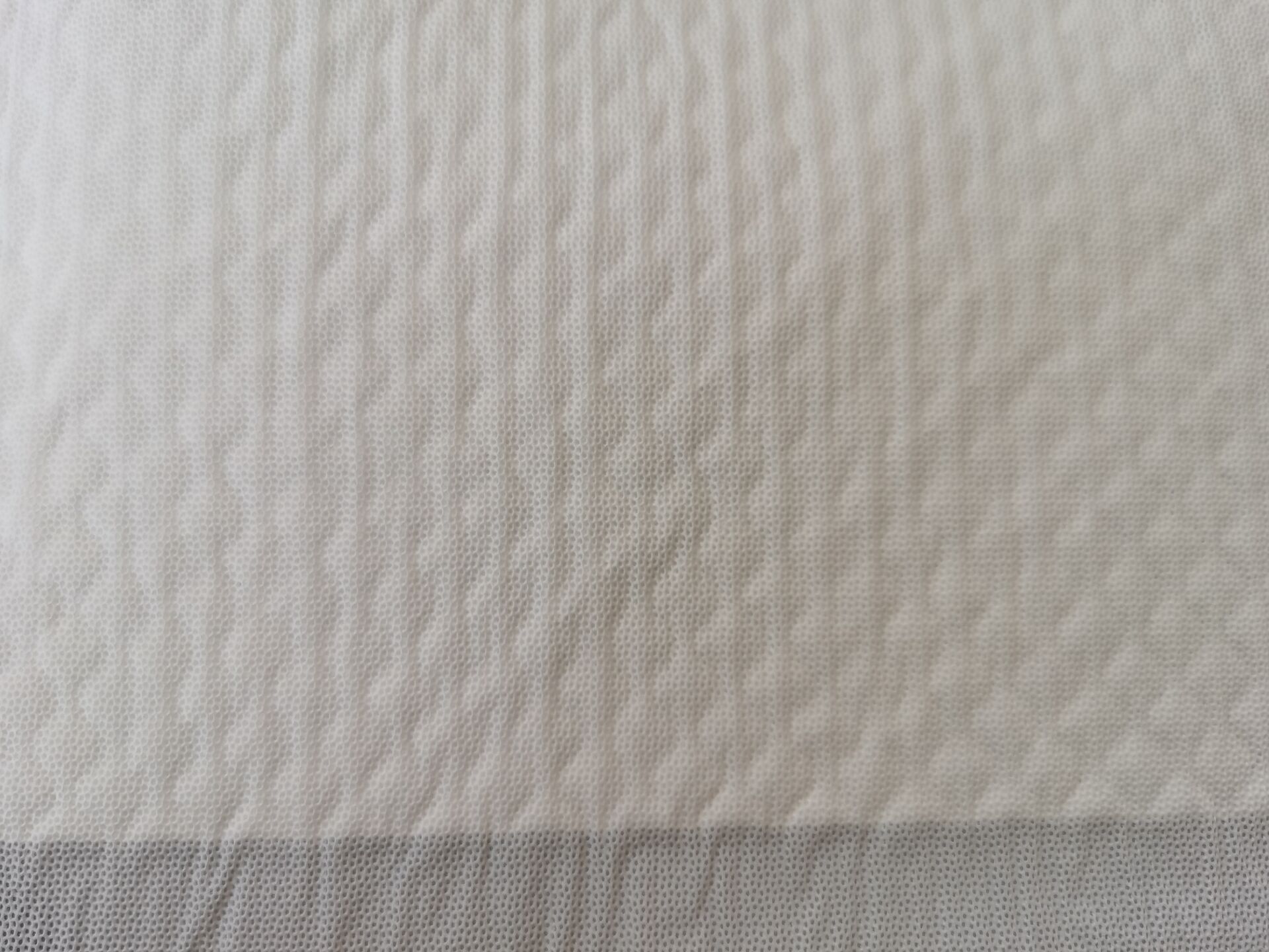 The surface layer is perforated membrane pet pad