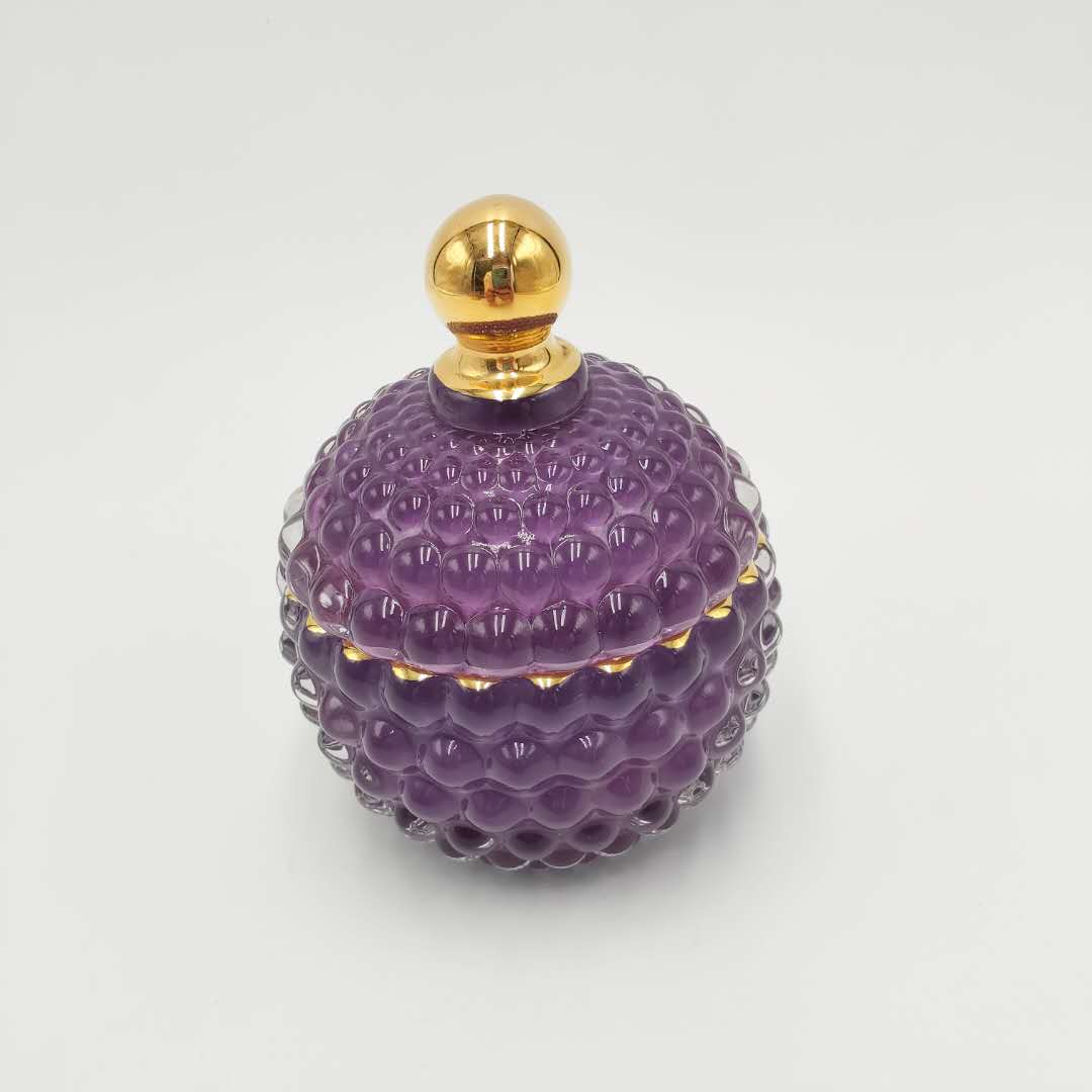 Handmade colored glass candy jar with bubble design