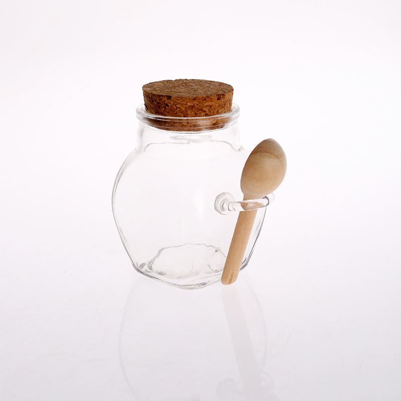 glass canister with cork lid and bamboo spoon