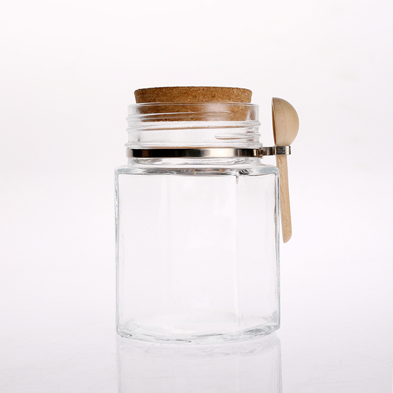 Glass canister with cork lid and bamboo spoon