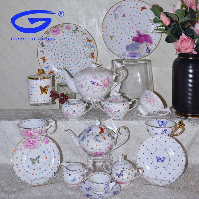 tea set with bird or butterfly decoration