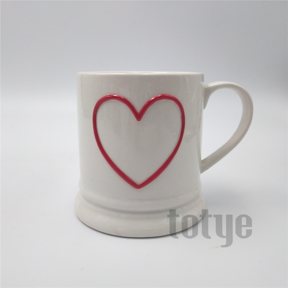 Stoneware mug with embossed heart