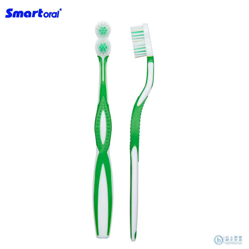 Adult angled toothbrush with unique 8 shape head