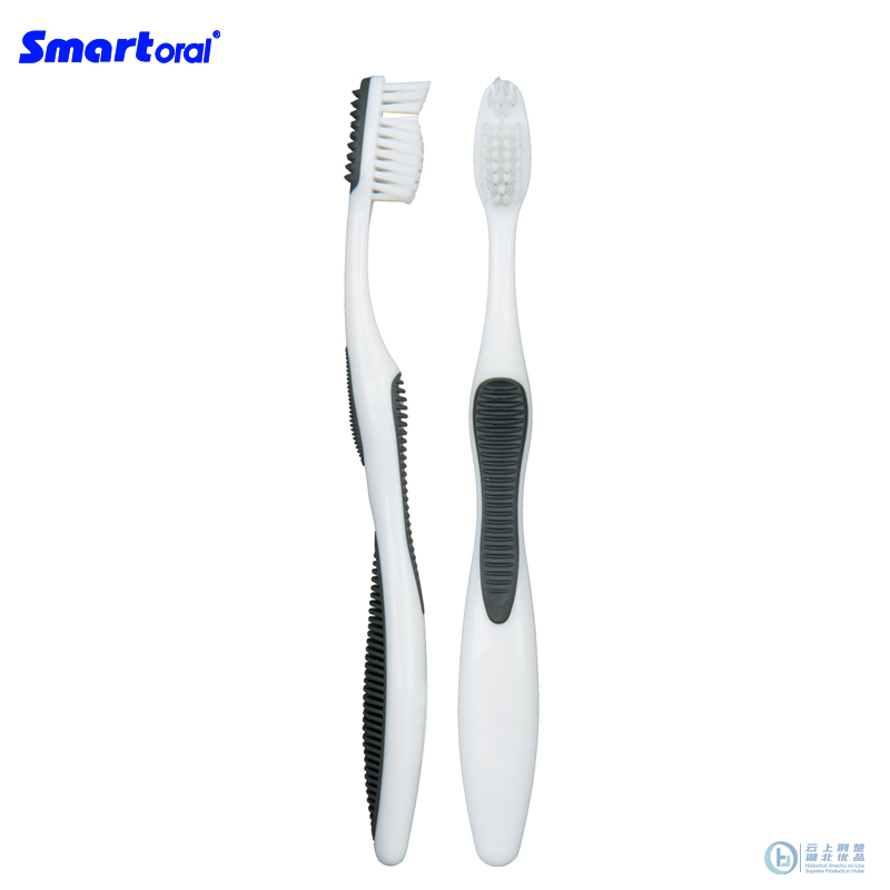 adult toothbrush with tongue cleaner