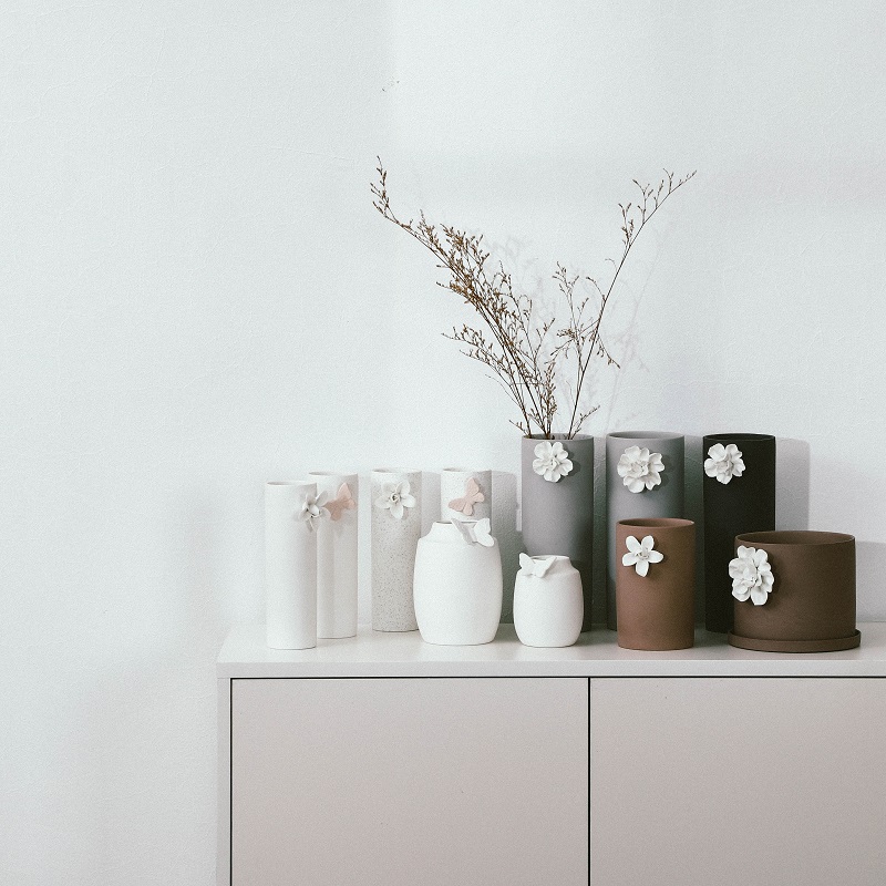 White vase with flower