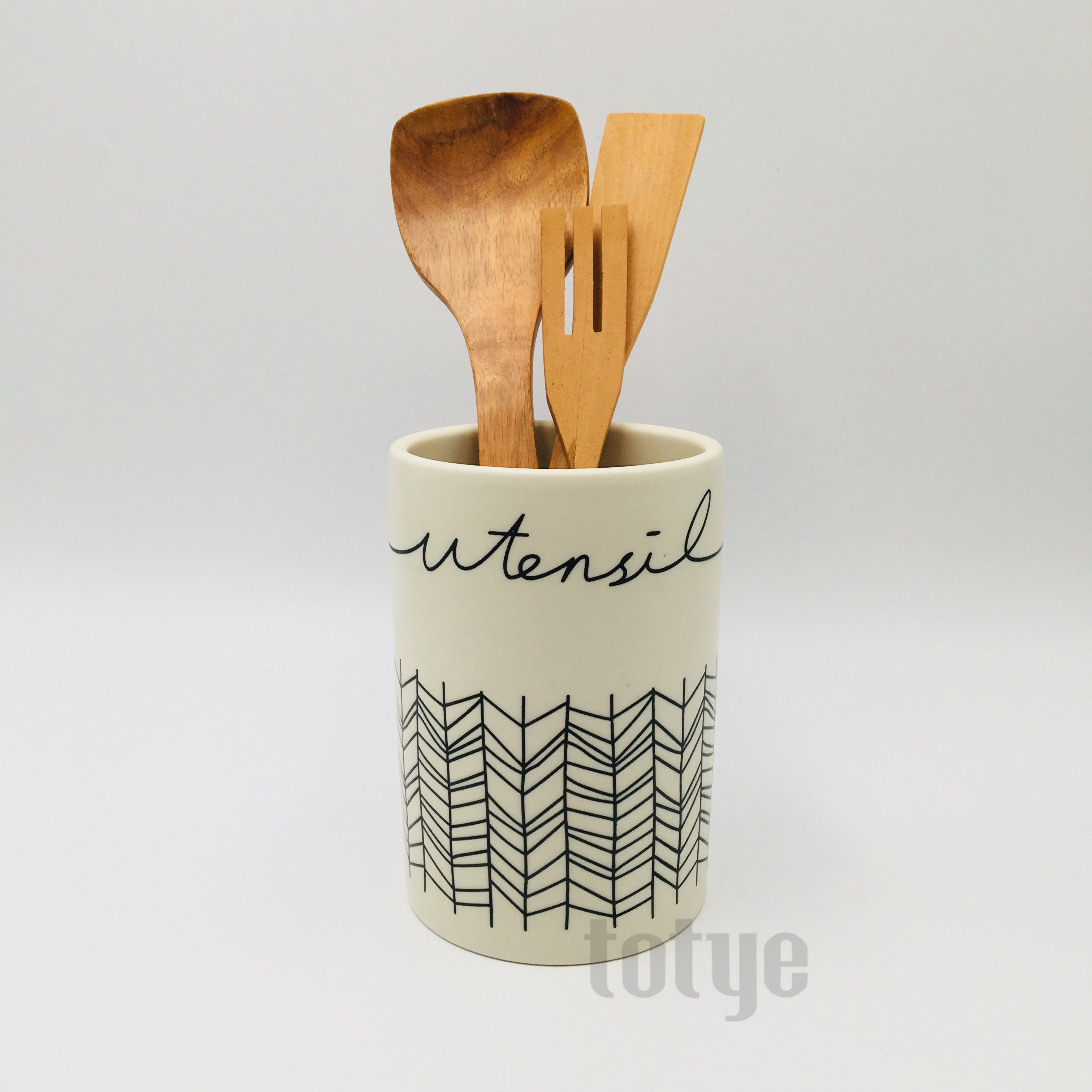 Stoneware utensil with silk print wax resist