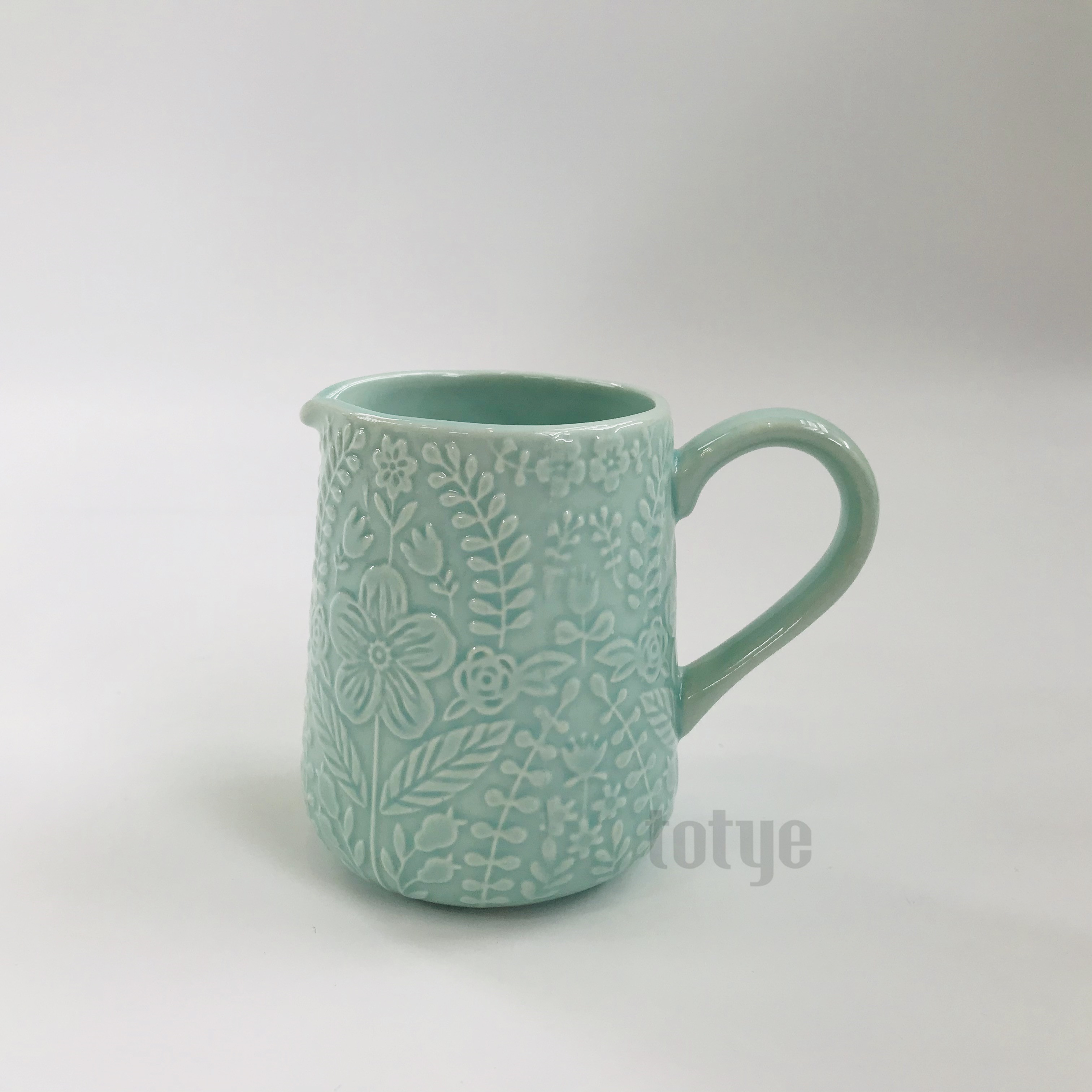 Stoneware color glaze creamer