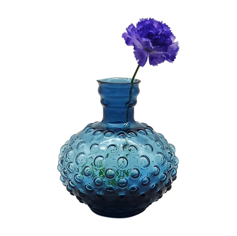 Blue glass vases with hobnail patterns