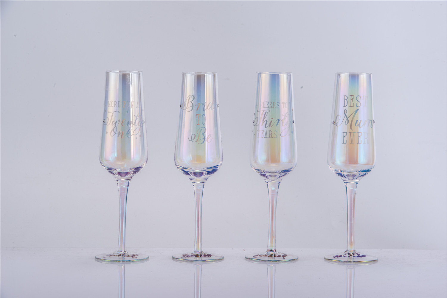 Iridescent champagne glasses with text