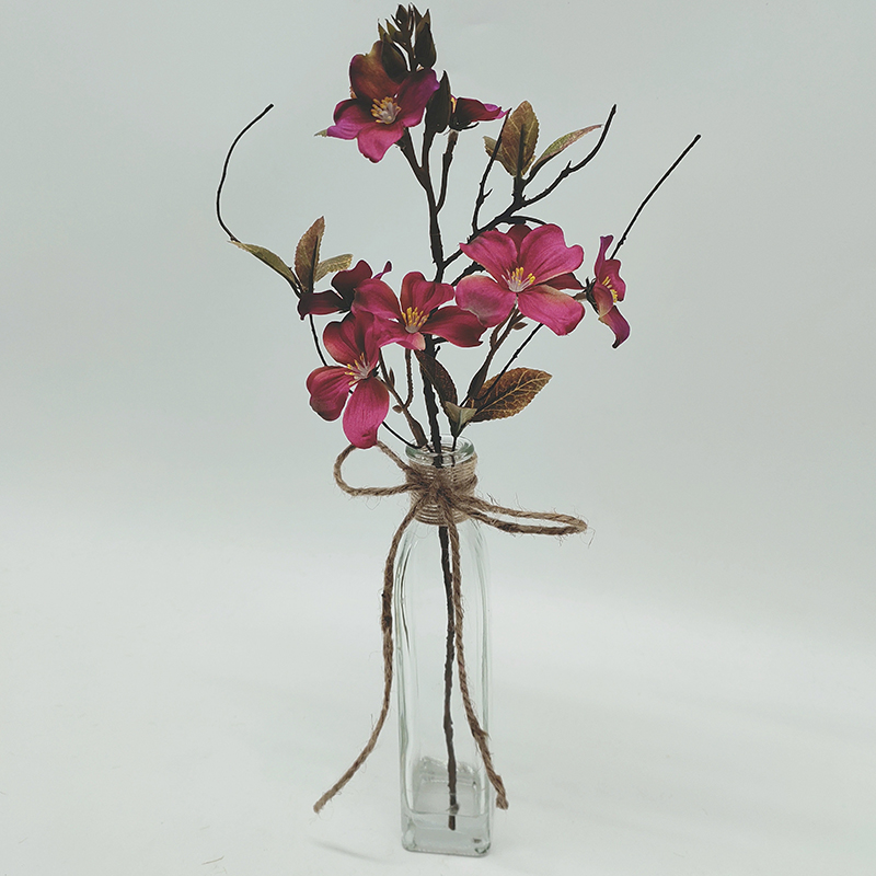 Artificial flower arrangement with glass base for decoration