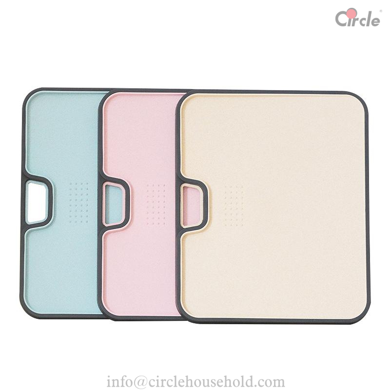 Reversible cutting board with juice catcher groove