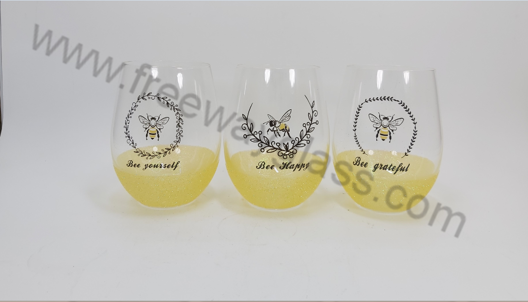 stemless wine glass with decal and yellow glitter