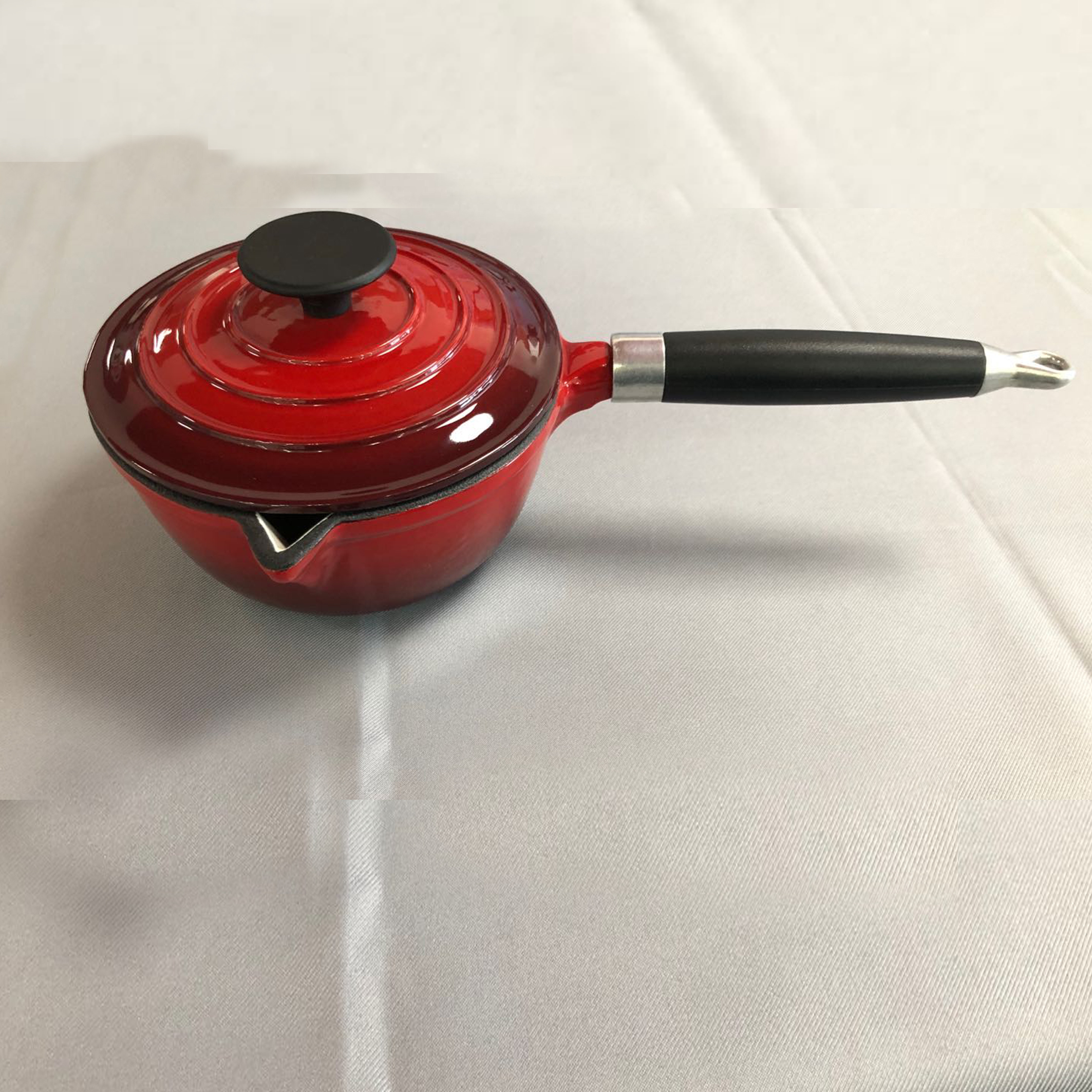 cast iron casserole with wooden handle