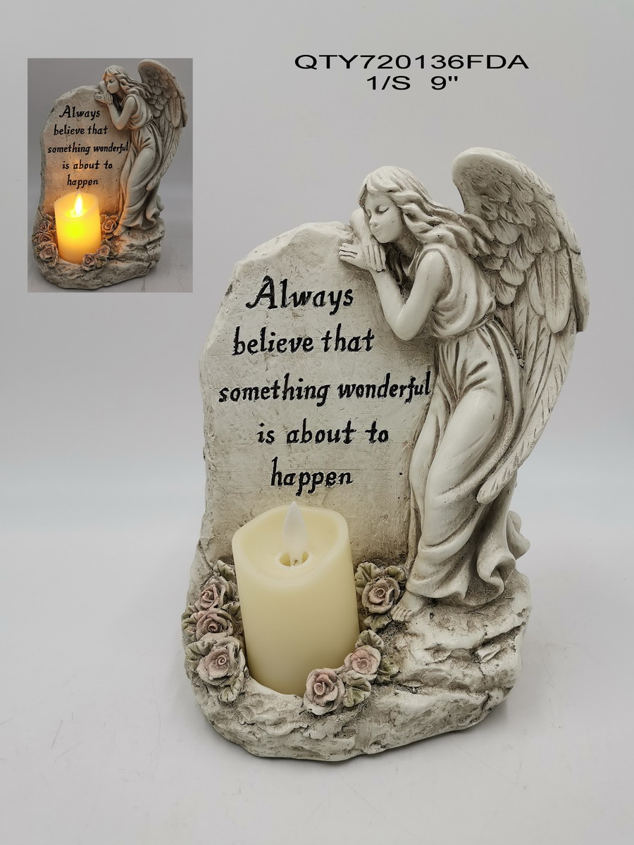 Cemetery angel with candle