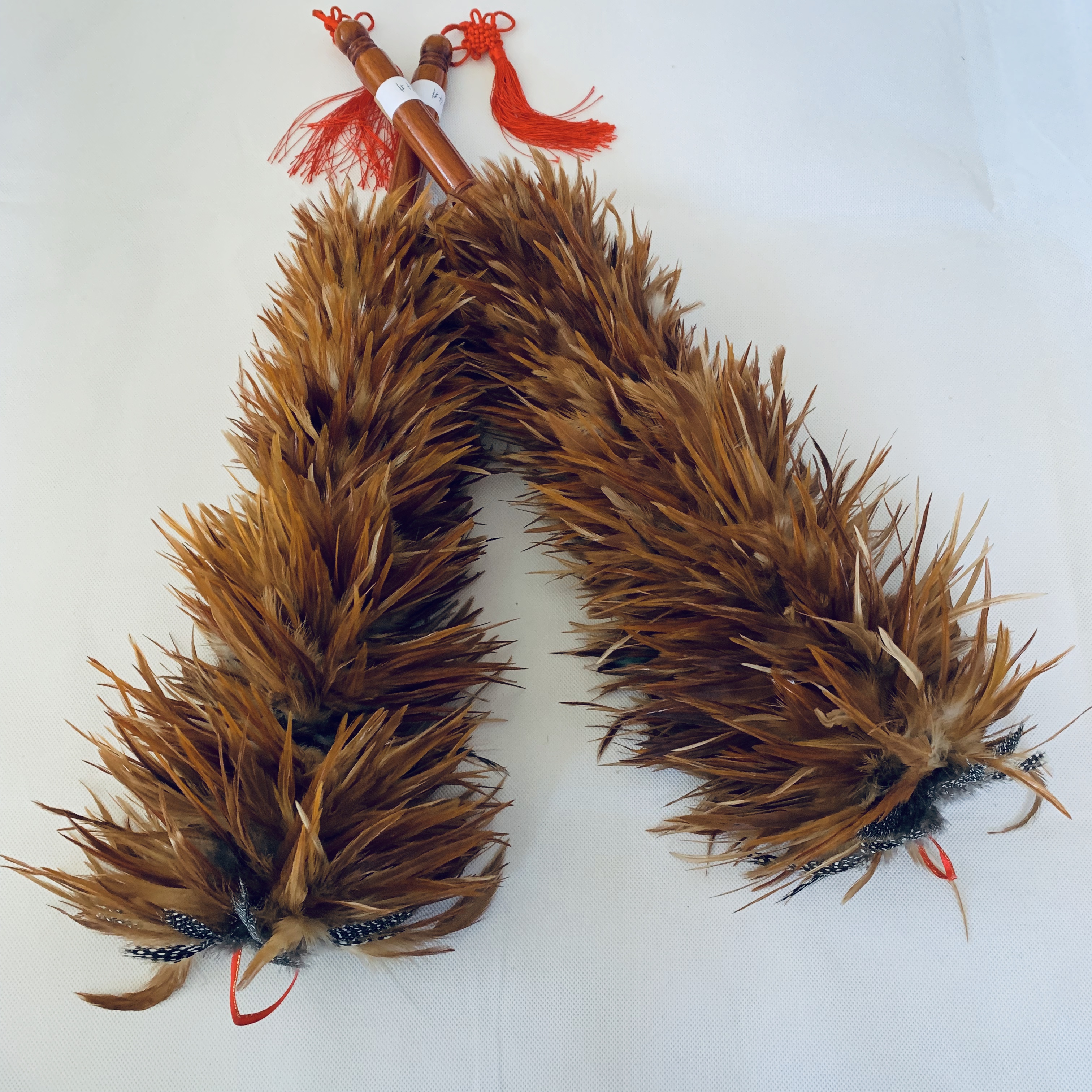 rooster feather duster with small woolden handle and chinese knot