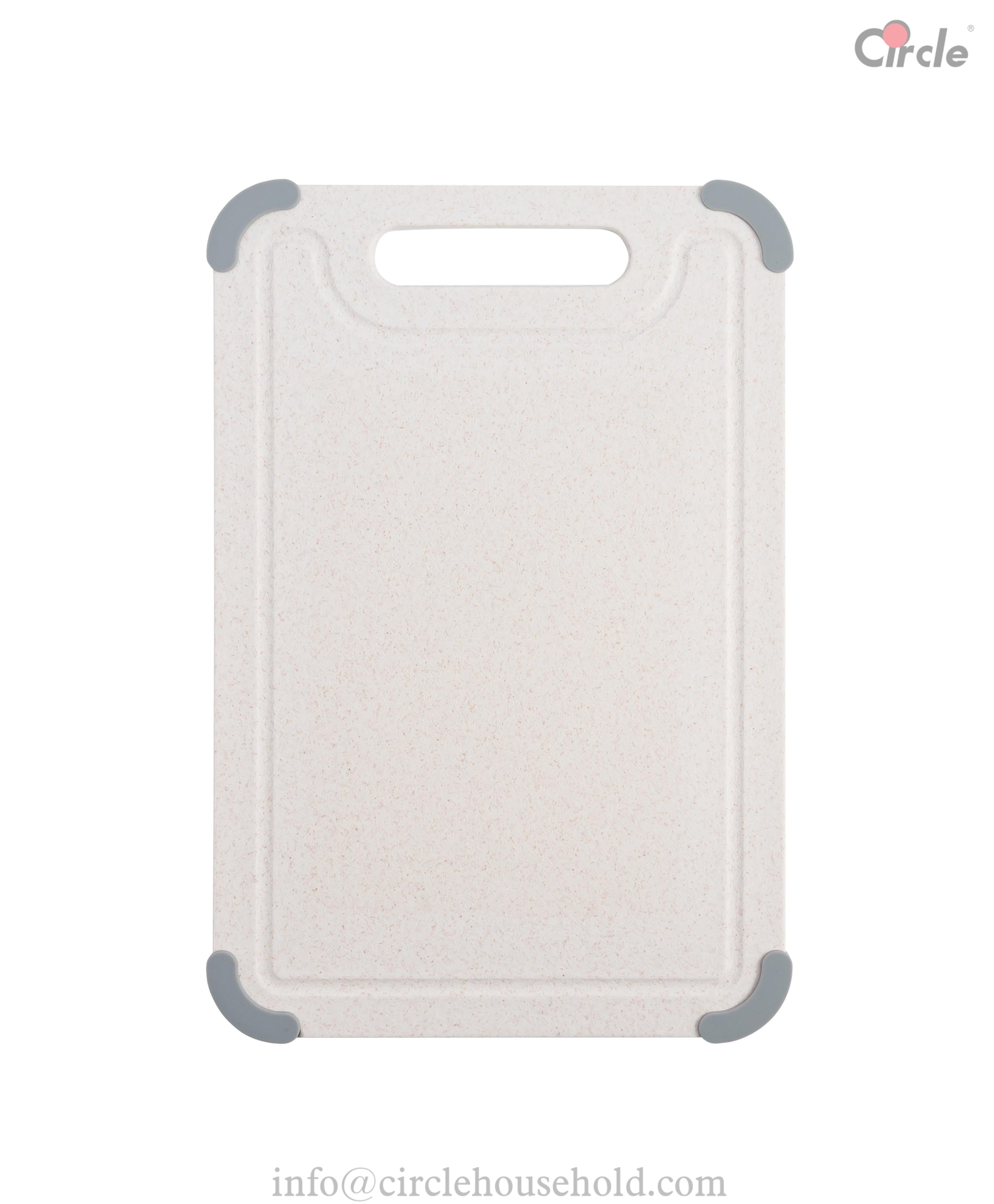 Cutting board with anti-slip corner