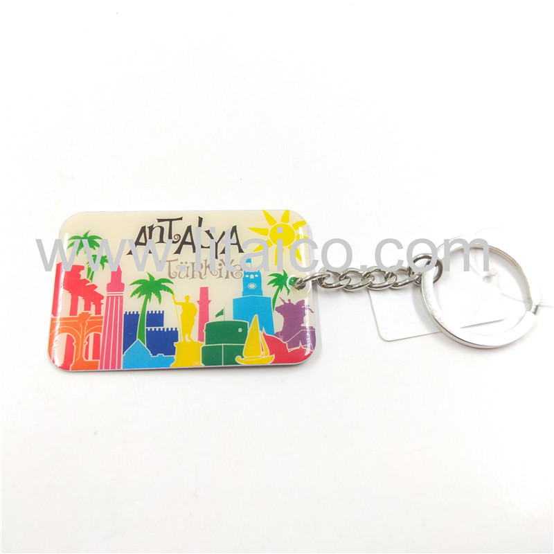 Resort style metal keychain
