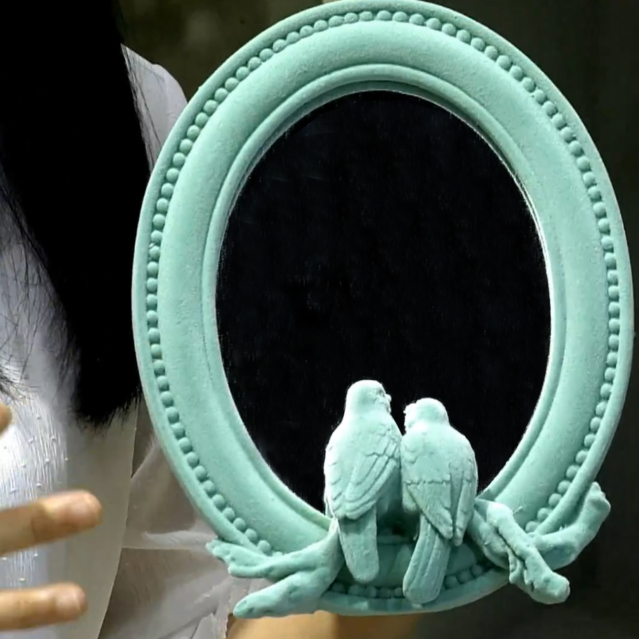 Mirror with loving birds